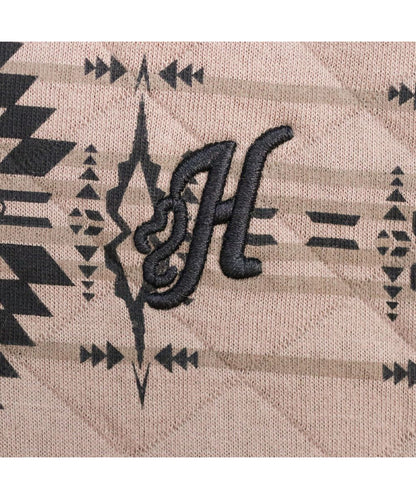 Close-up view of the logo embroidery at the left chest