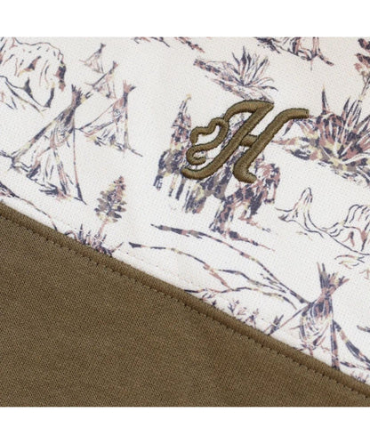 Close-up view of the logo embroidery at the left chest