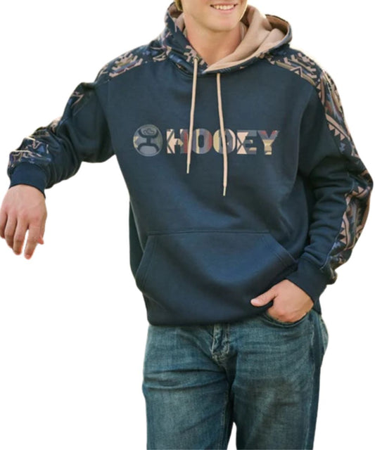 Model view of the men's Hooey Canyon Hoody Dark Navy With Aztec Detailing featuring the hidden phone pocket in the kangaroo pocket