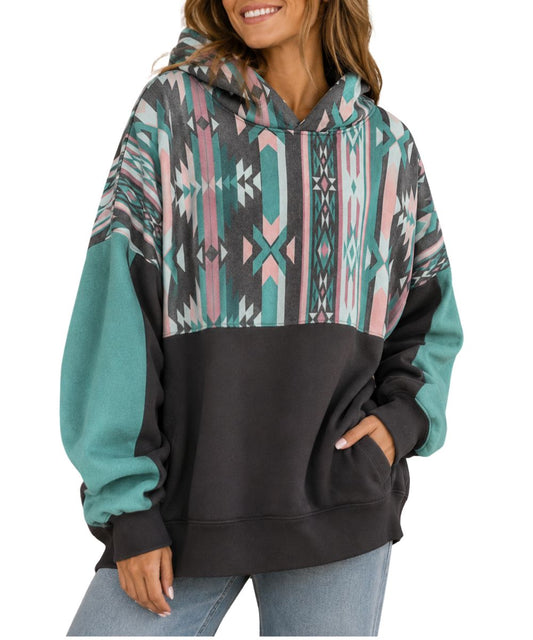 Model view of the women's charcoal hoodie featuring the oversized fit and aztec color-blocked upper body