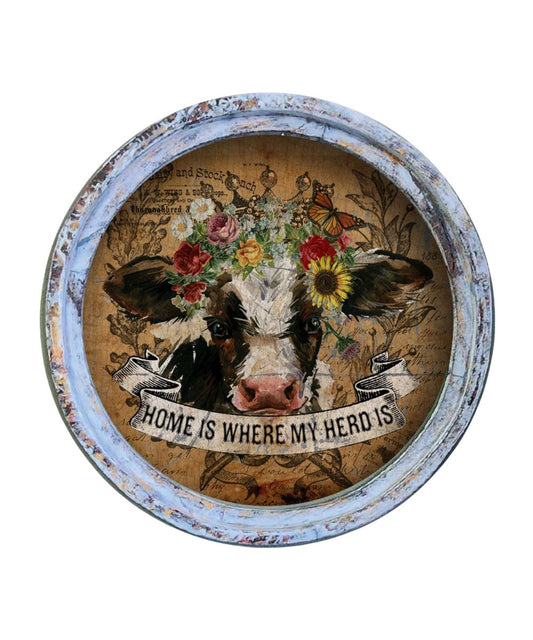 Framed circle artwork reads: "Home is where my herd is"