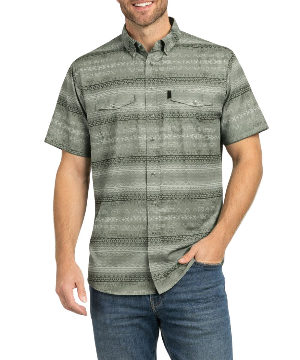 Front view of a man modeling the fog green short sleeve snap shirt featuring pearl snaps and an aztec print