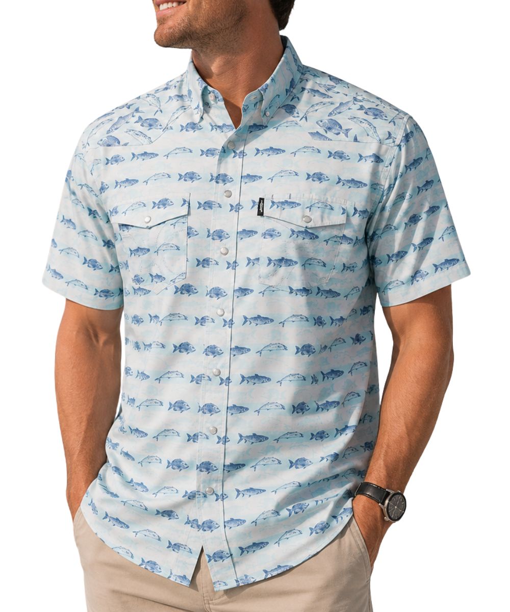 Front view of a man modeling the cloud blue short sleeve snap shirt featuring pearl snaps, chest pockets, and a snapper fish print