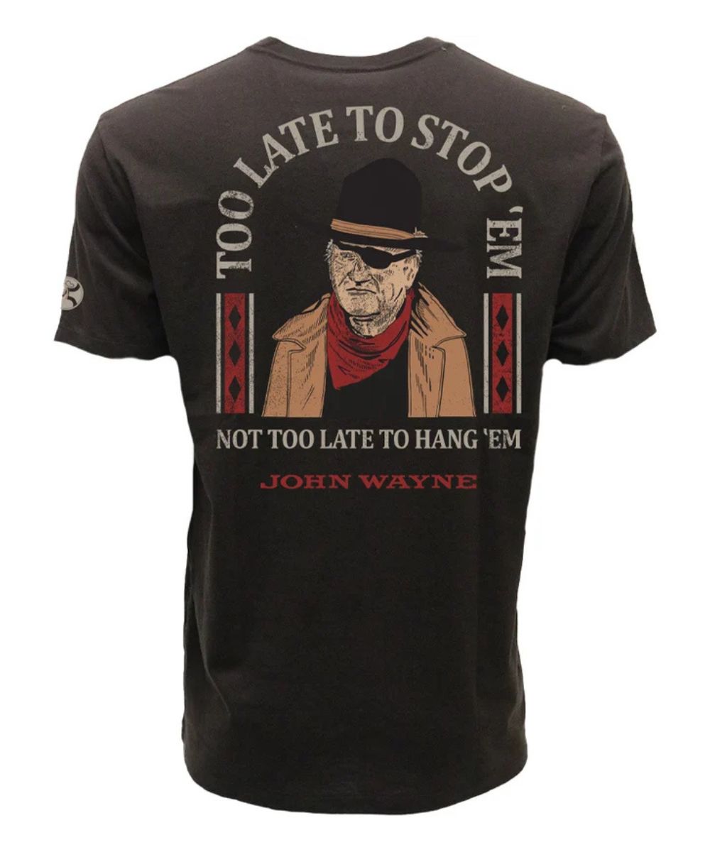 Dark brown tshirt with John Wayne on back with "TOO LATE TO STOP 'EM, NOT TOO LATE TO HANG 'EM" and "JOHN WAYNE"