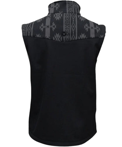 Back view of the boy's black softshell vest featuring the single point grey aztec western yoke