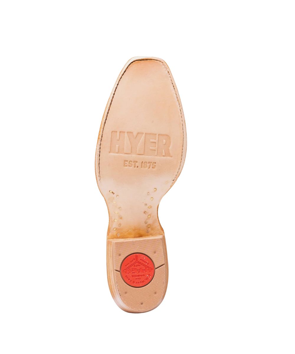 The underside of a light tan leather shoe sole, showing the embossed brand name 'HYPER EST. 1976' and a circular red heel cap, isolated on a white background.