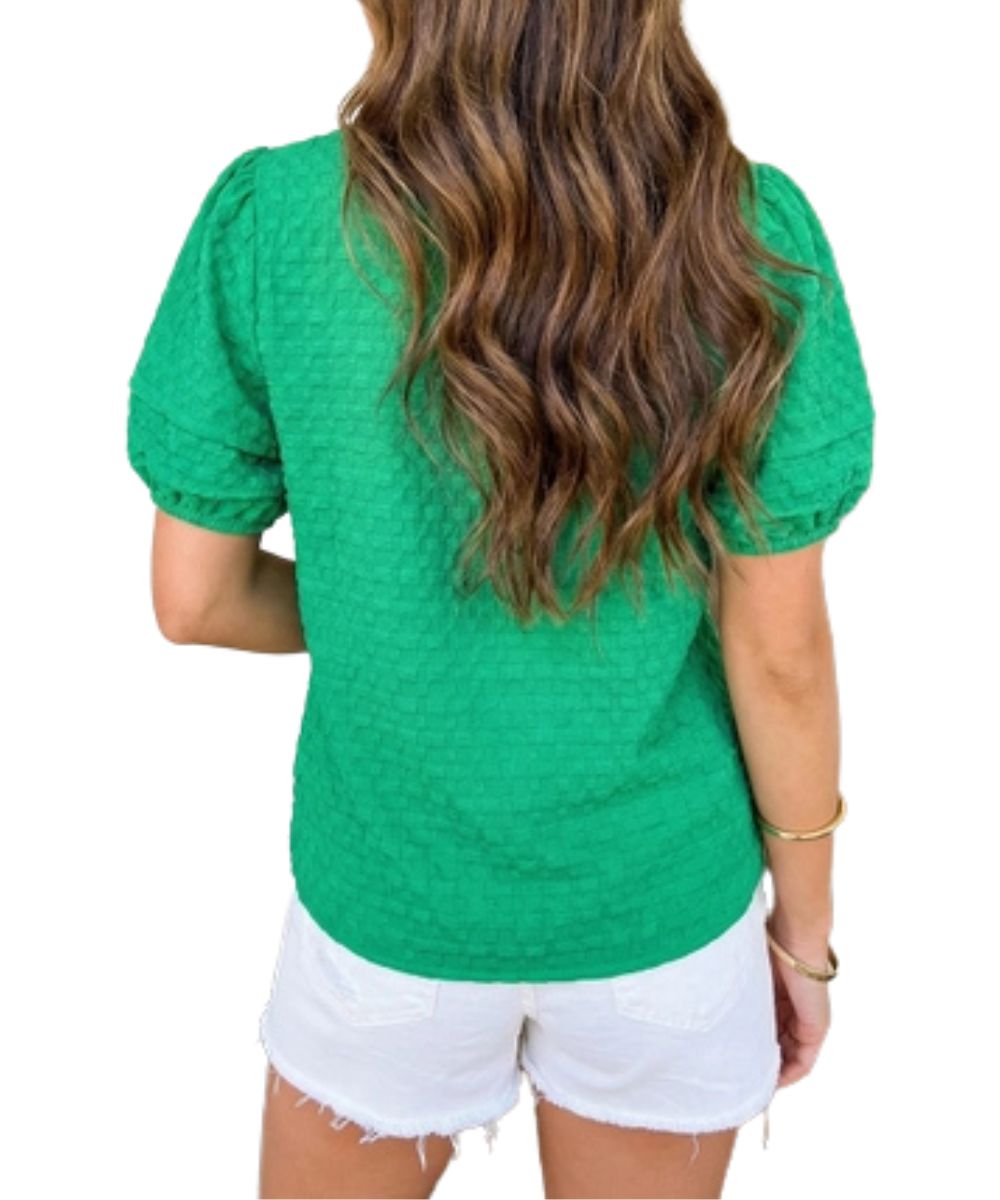 Back view of the women's solid bright green textured blouse