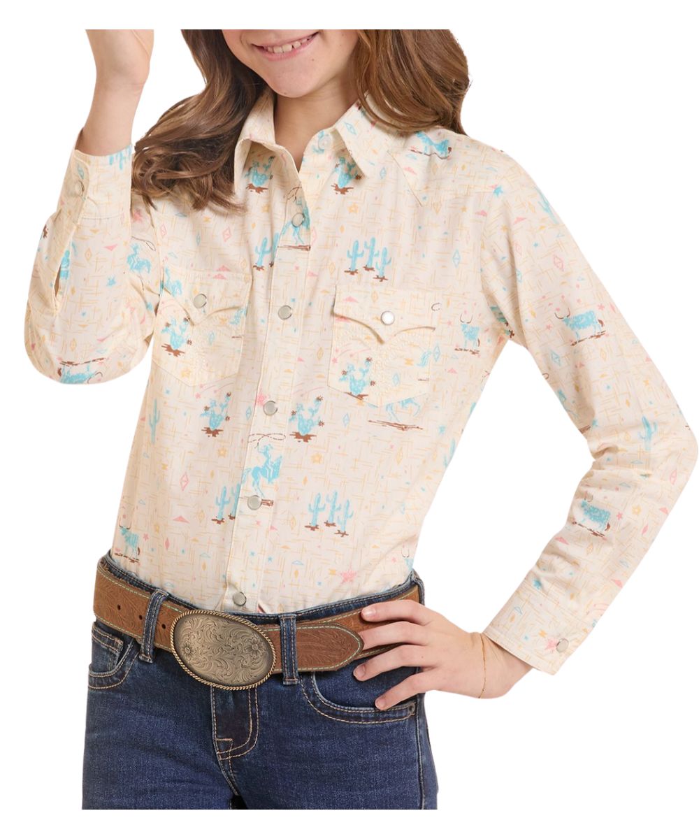 Front view of the girl's ecru Panhandle Slim long sleeve snap shirt featuring the spread collar, snap flap chest pockets, western yokes, and the geometric crosshatch landscape print