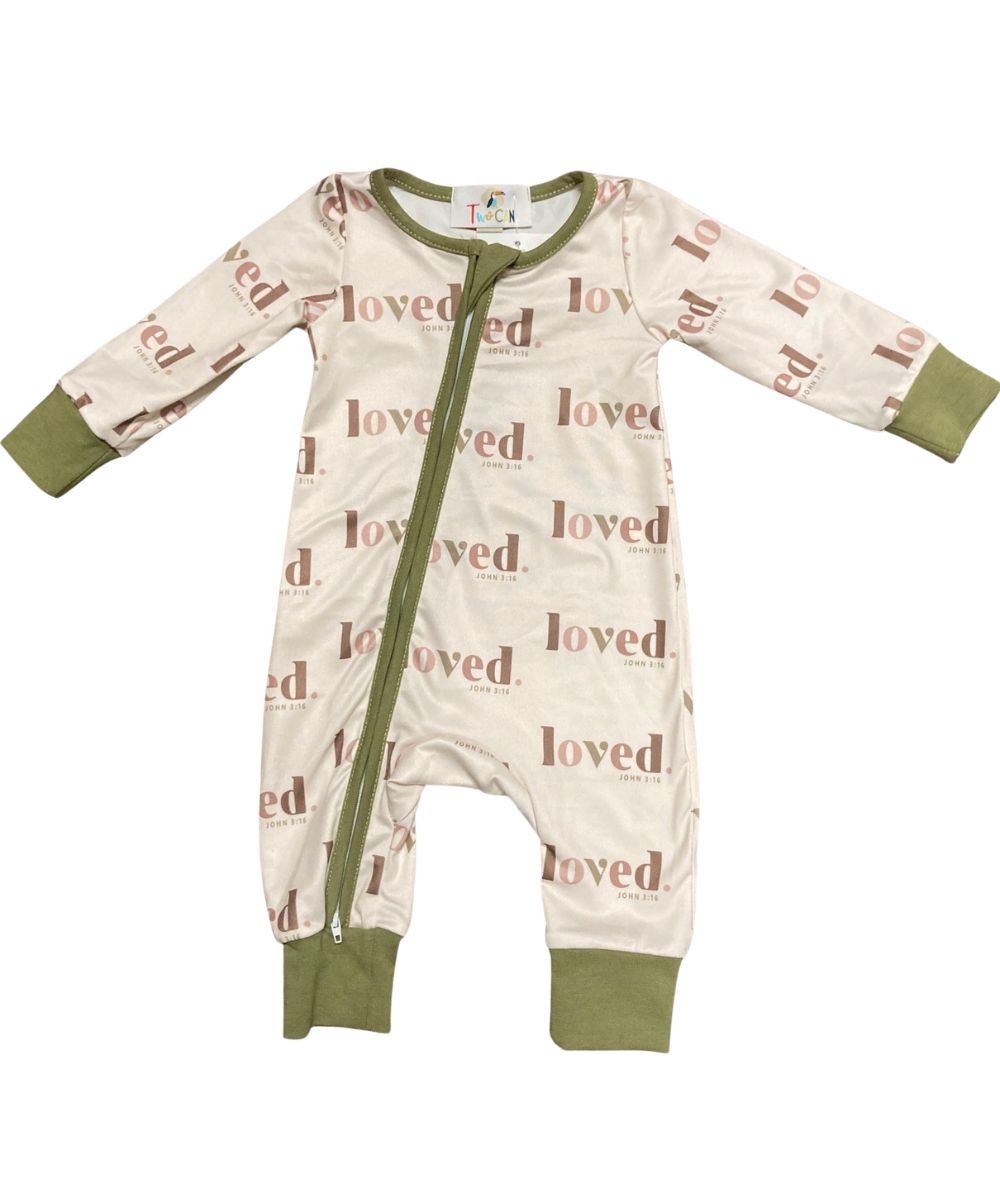 Cream Romper With Green Contrast Trim Featuring An Angled Zipper With Neck Guard