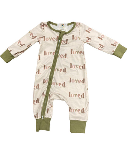 Cream Romper With Green Contrast Trim Featuring An Angled Zipper With Neck Guard
