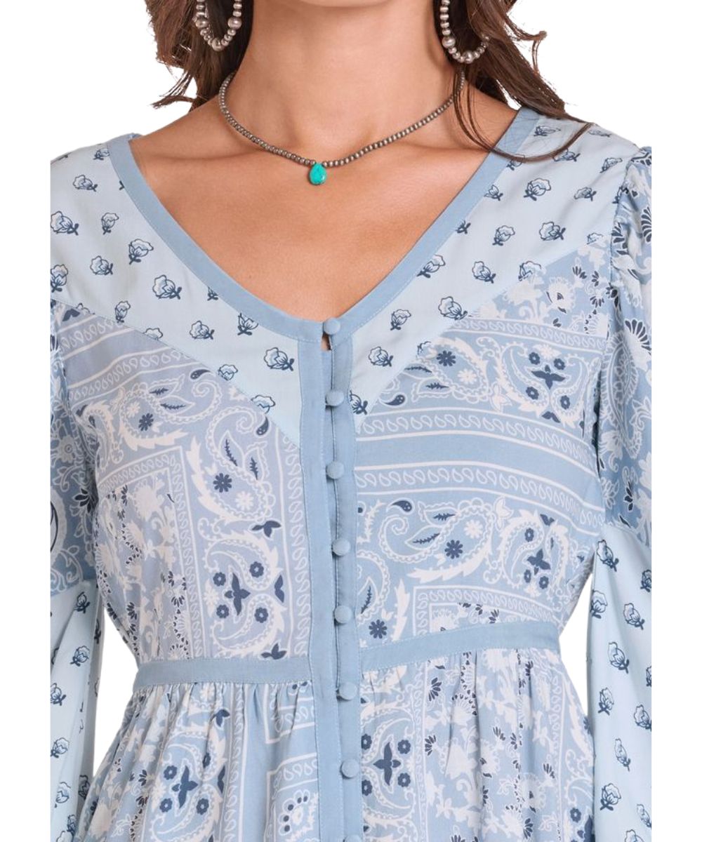Close-up view of the button closure and multi bandana patchwork print
