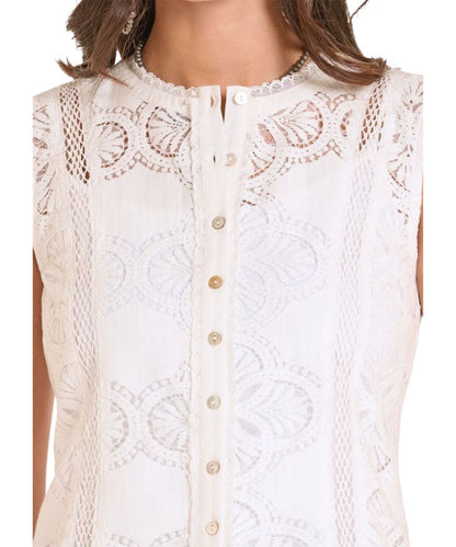 Close-up view of the lace front detailing and shell buttons