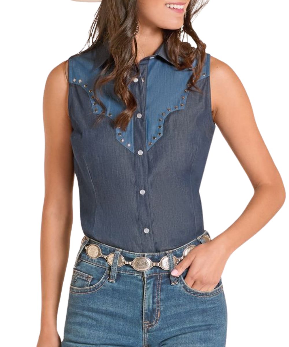 Front view of the women's sleeveless denim snap shirt featuring retro yokes with studded trim