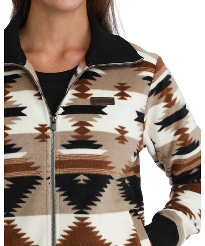 Close-up view of the aztec printed polar fleece featuring the leather logo label at the chest