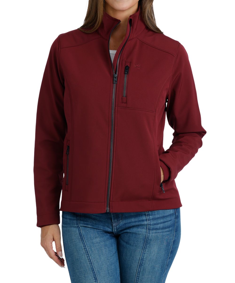 Front view of the women's burgundy Cinch bonded jacket featuring the zip closure, zippered hand and chest pockets, and the durable water-resistant finish