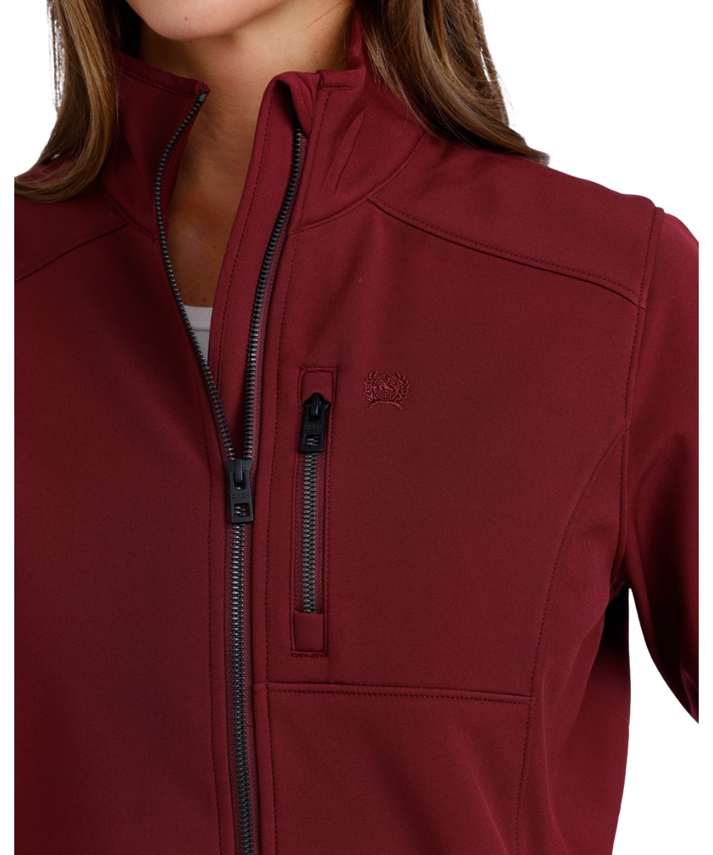 Close-up view of the zippered chest pocket and stand-up mock collar