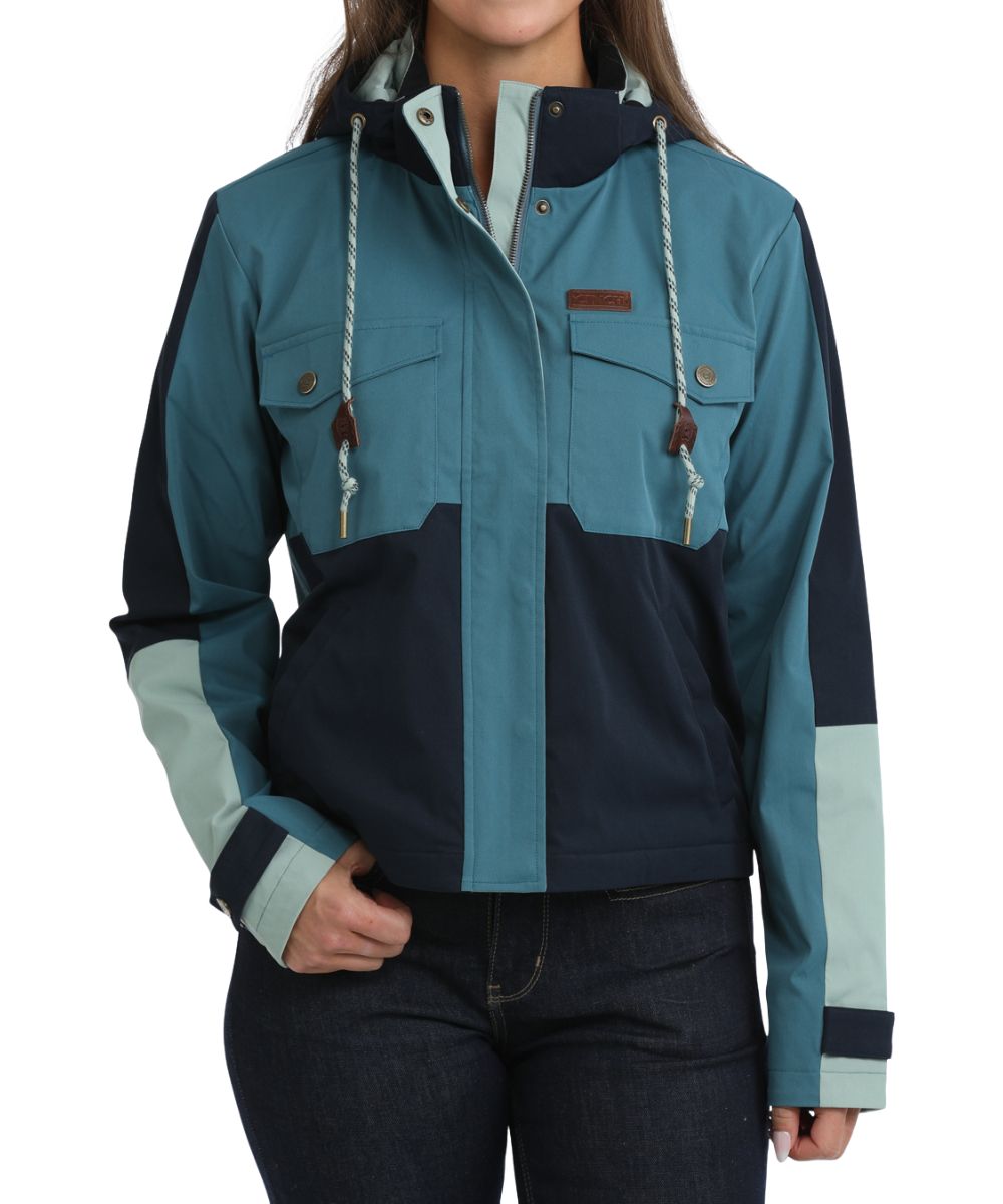 Front view of the women's teal color blocked Cinch Chore Jacket featuring the removable/adjustable hood, zip closure with snap storm flap, snap flap chest pockets, snap cuffs, and hand pockets