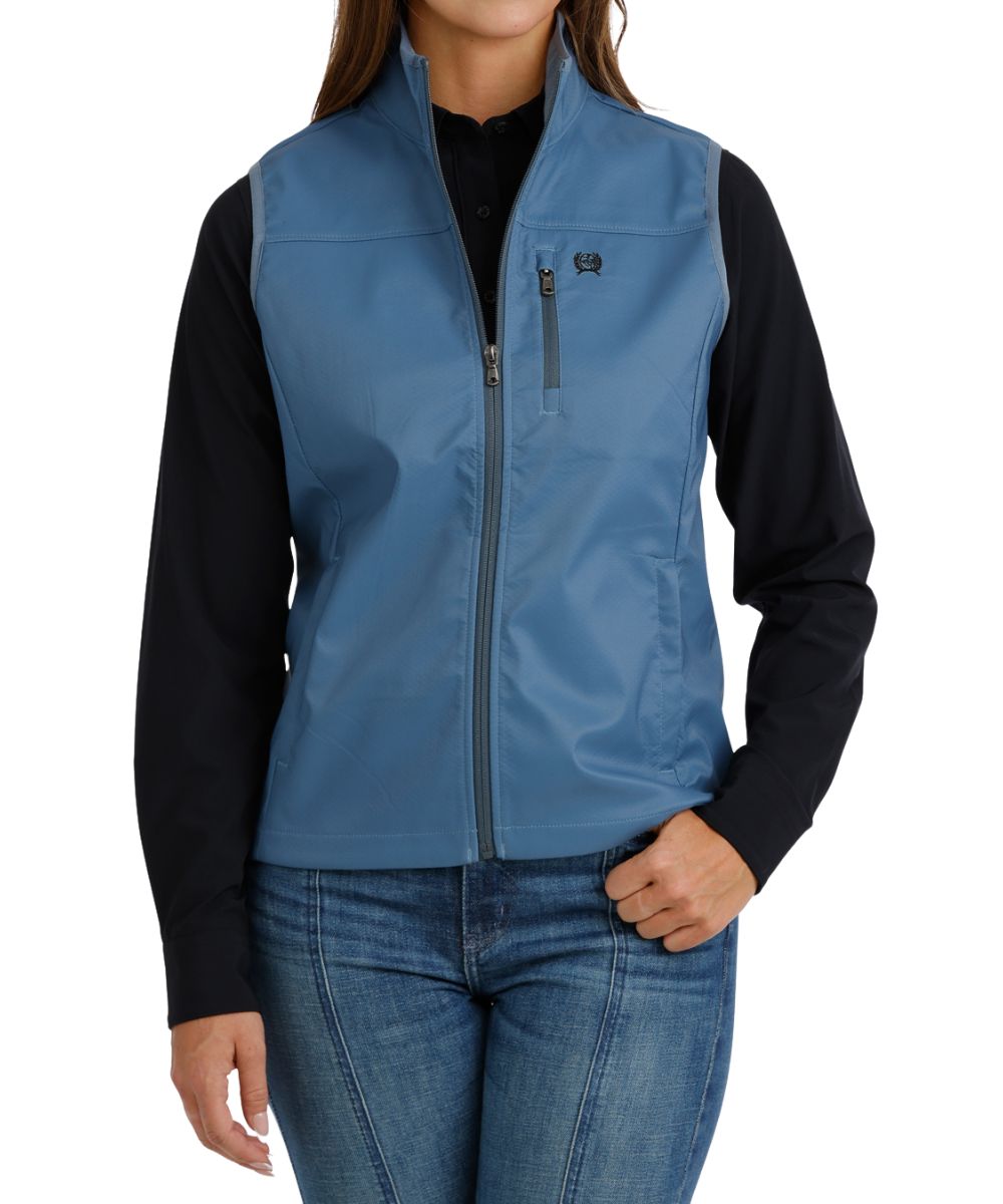 Front view of the women's blue Cinch windproof vest featuring the zip closure, hand pockets, and mock collar