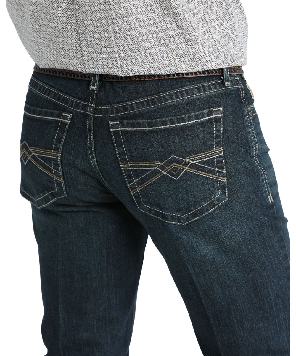 Close-up view of the cream and brown stitched back pockets