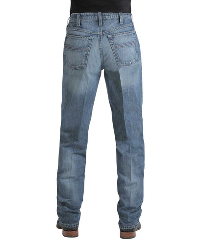 Back view of the men's medium stone rigid jean featuring the tonal stitched back pockets and the tapered straight leg