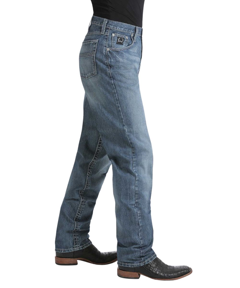 Side view of the men's black label 2.0 jean featuring the tapered straight leg with a 17" leg opening