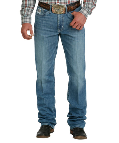Front view of the men's medium stonewash white label jean featuring a mid rise and relaxed fit