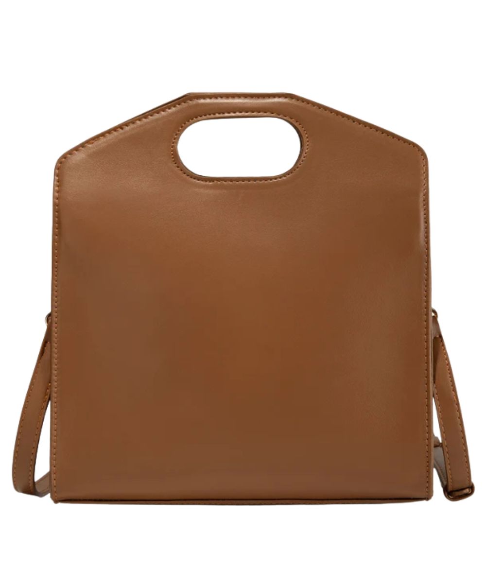 Back view of the women's brown faux leather handbag with a top handle cutout and a shoulder strap