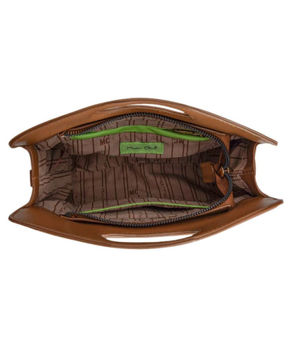 An open brown purse showing its interior lining with a brown monogram pattern, a bright green zipper track, open slip pocket, and a green interior label.