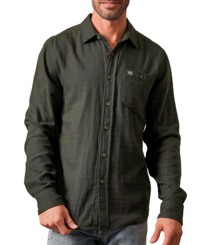 Front view of the men's forest green Kimes Ranch long sleeve button down flannel shirt featuring the button-through chest pocket, spread collar, and check plaid print