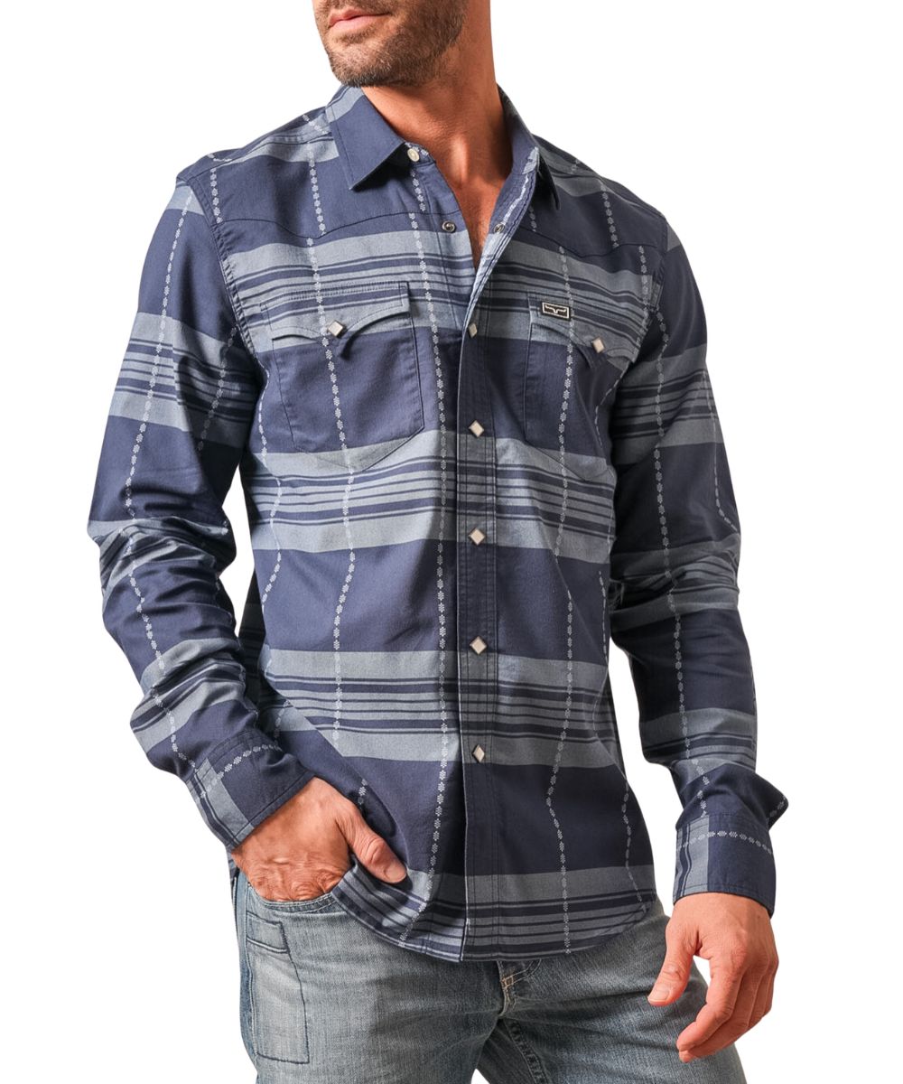 Front view of the men's dark blue Kimes Ranch snap shirt featuring the long sleeves, spread collar, diamond-shaped pearl snaps, chest pockets, western yokes, and horizontal tonal striping with vertical embroidered print
