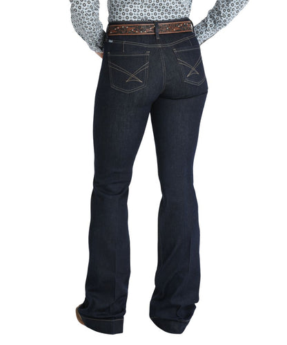 Back view of the women's indigo/rinse trouser jean featuring the moderate rise, five pocket styling, slim flare leg with a trouser hem, and the iconic tan stitched back pocket design