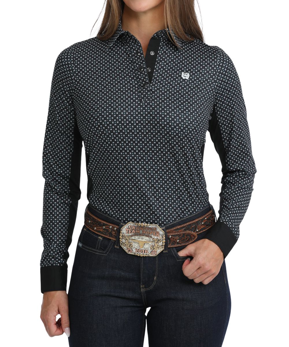 Front view of the women's black Cinch long sleeve hybrid snap shirt featuring the 1/4 snap closure, snap cuffs, spread collar, and white geometric print