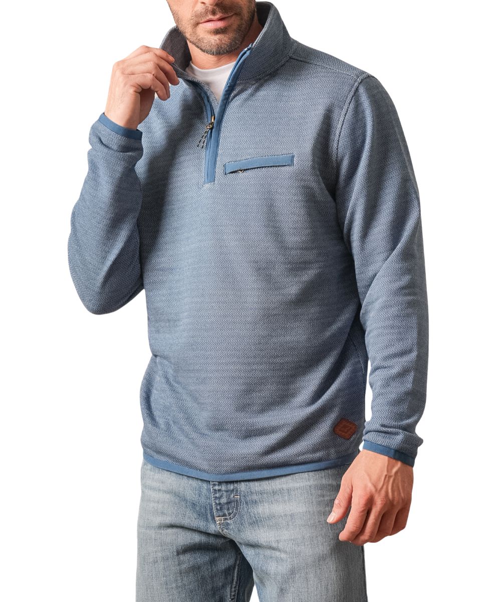 Front view of the men's blue Kimes Ranch long sleeve pullover featuring the houndstooth pattern, mock collar, 1/4 zip closure, zippered welt chest pocket, and a leather logo patch at the hem