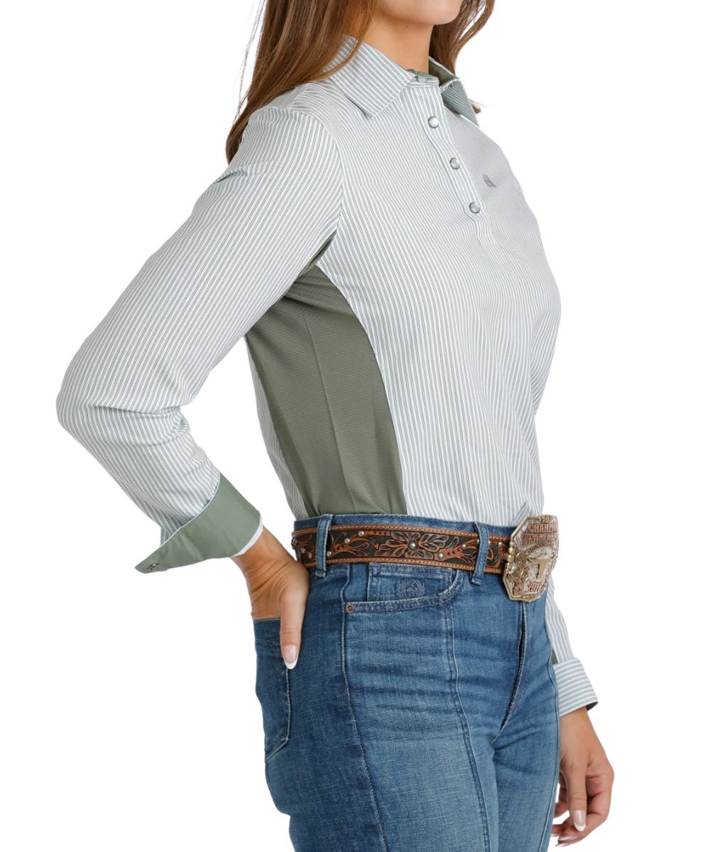 Side view of the women's white 1/4 snap long sleeve shirt featuring the green vertical striped print and snap cuffs