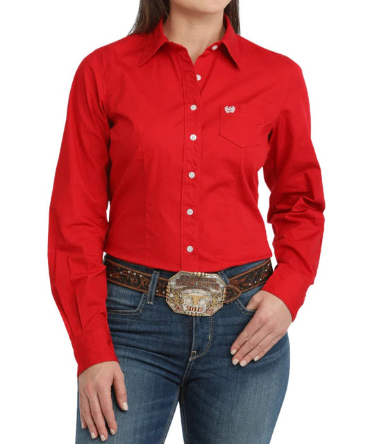 Front view of the women's solid red arena fit long sleeve button down western shirt featuring the single open chest pocket