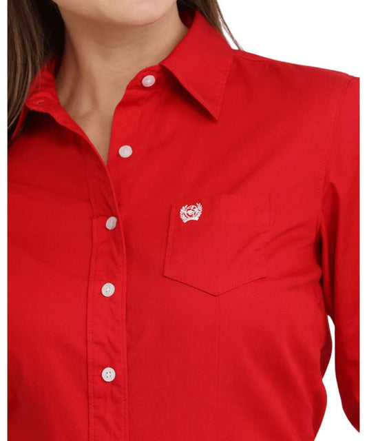 Close-up view of the solid red print featuring the darting for a flattering fit