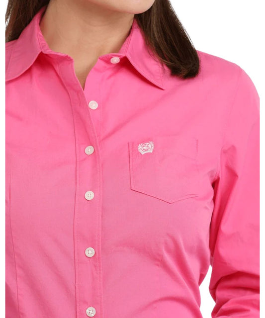 Close-up view of the women's pink button down shirt featuring the darting for a flattering fit