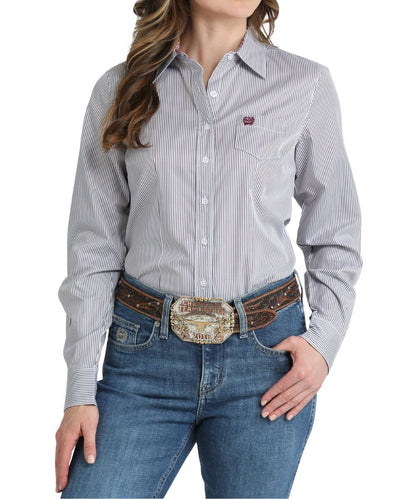 Front view of the women's white long sleeve striped shirt featuring a single open chest pocket and white buttons