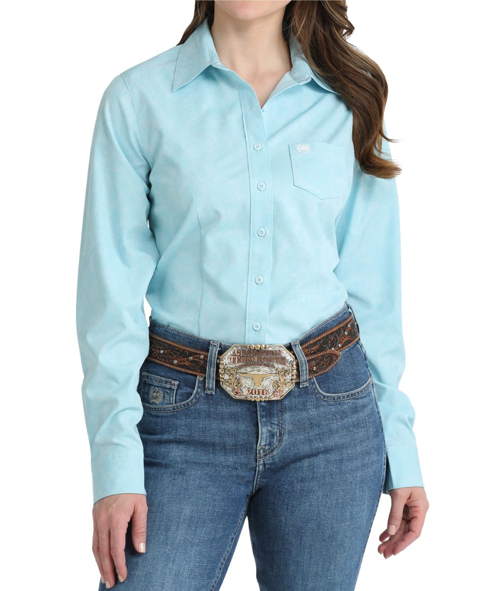 Front view of the women's long sleeve button down shirt featuring a floral geometric print and open chest pocket