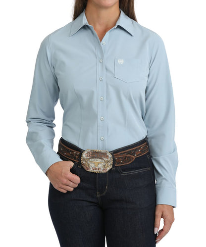 Front view of the women's Cinch Solid Light Blue ArenaFlex Button Down Shirt featuring the long sleeves and chest pocket