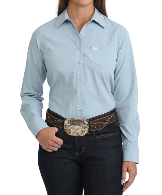 Front view of the women's Cinch Solid Light Blue ArenaFlex Button Down Shirt featuring the long sleeves and chest pocket