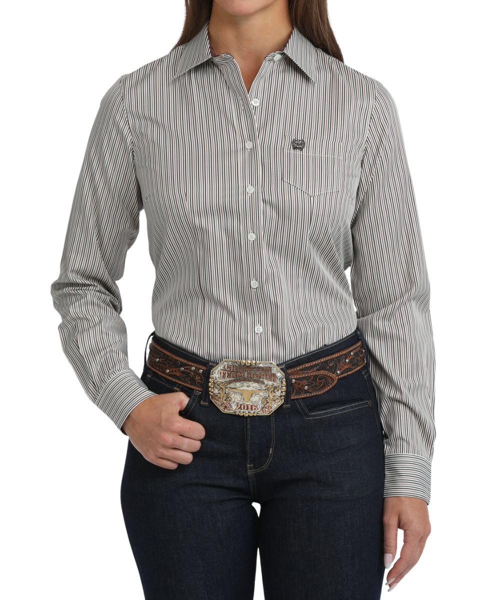 Front view of the women's white Cinch long sleeve button down shirt featuring the spread collar, chest pocket, white buttons, and vertical striped print