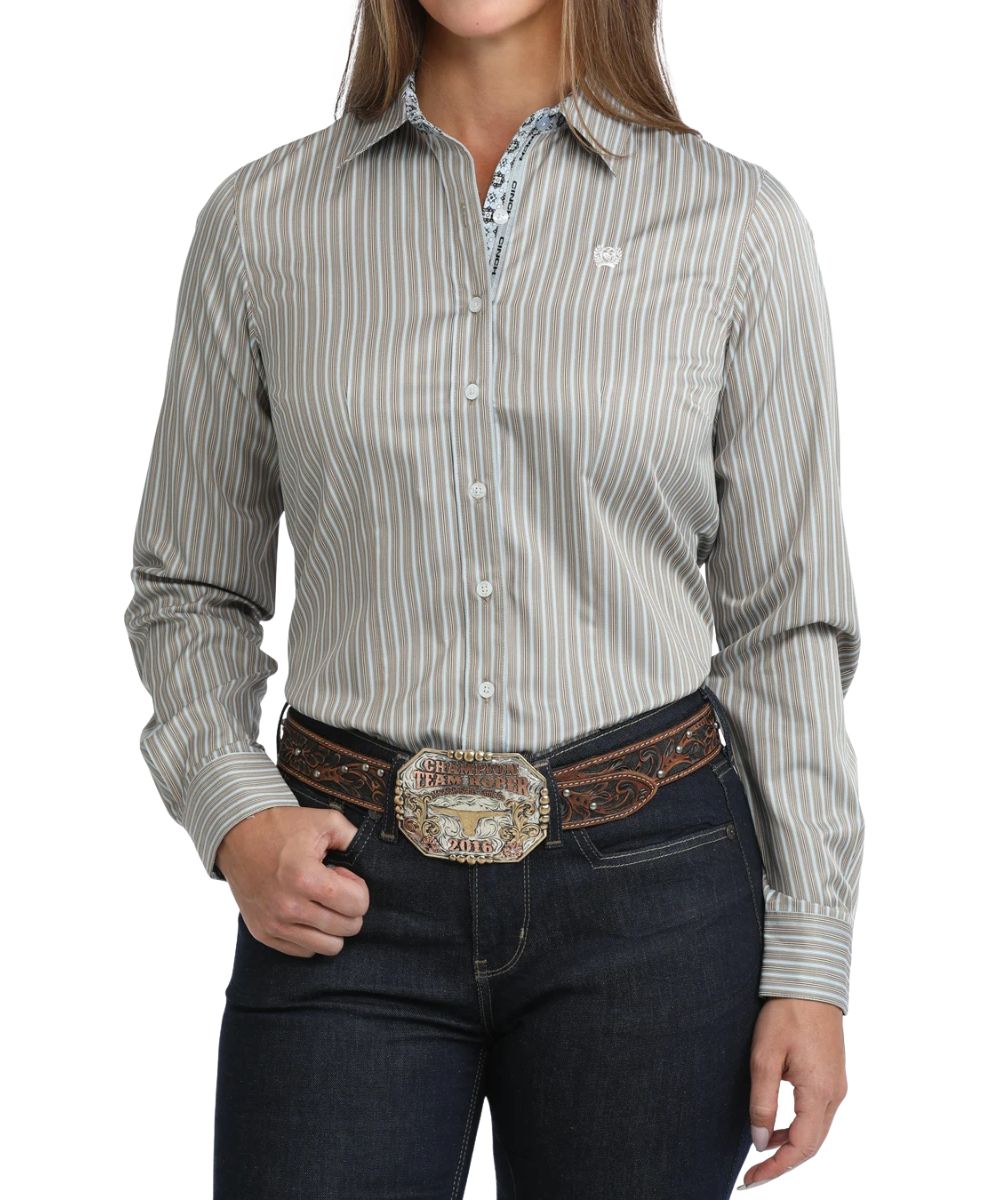 Front view of the women's brown Cinch long sleeve button down shirt featuring the striped print, white buttons, and logo embroidery at the left chest