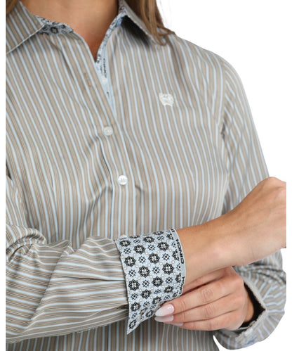 Close-up view of the vertical striped print, white buttons, and contrast interior trim