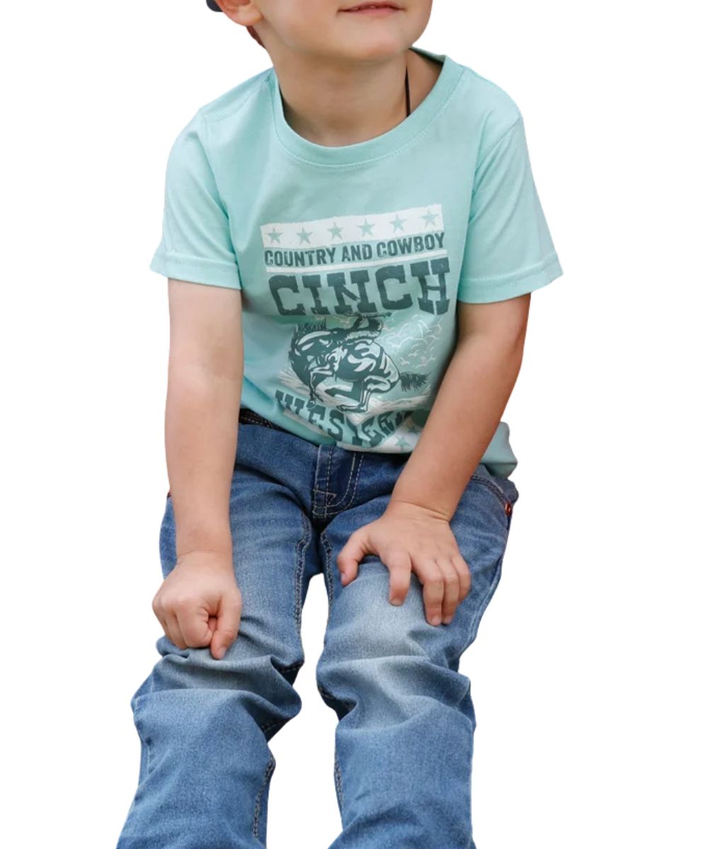 Front view of the infant boy's turquoise Cinch graphic tee featuring the short sleeves, crew neck, and front screen-printed cowboy graphic that reads: "Country And Cowboy Cinch Western"