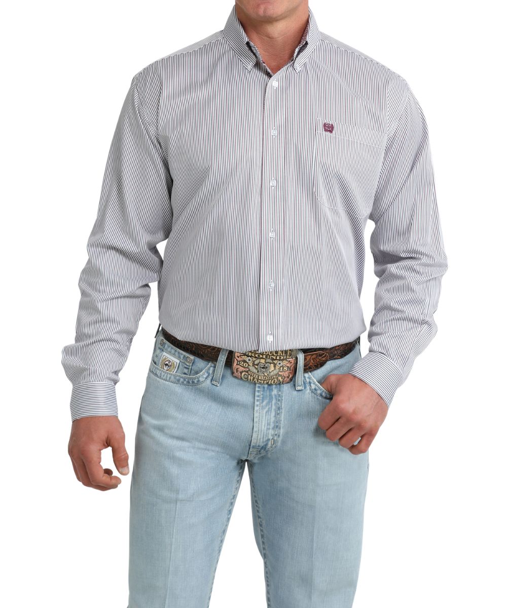 Front view of the men's white long sleeve button down shirt featuring a striped print, chest pocket, and a button down collar