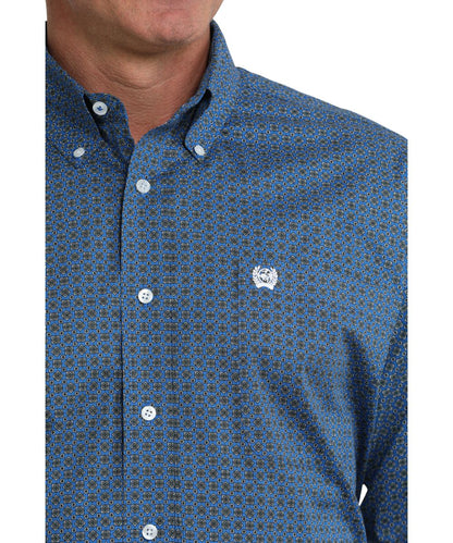 Close-up view of the royal blue shirt featuring a geometric print