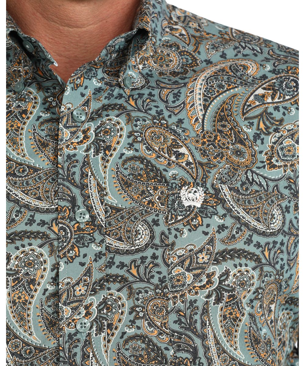 Close-up view of the paisley print and single open chest pocket with logo embroidery