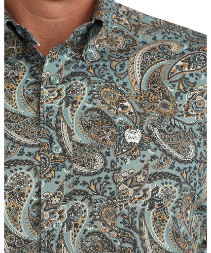 Close-up view of the paisley print and single open chest pocket with logo embroidery