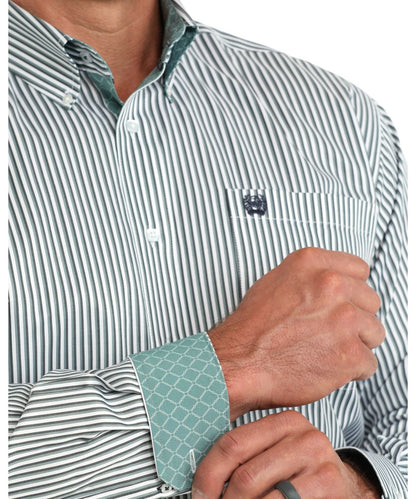 Close-up view of the button down collar, chest pocket, contrast interior trim, and blue striped print